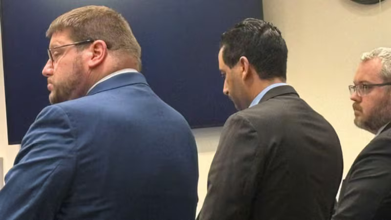 Luciano Frattolin, center, in court Monday in Elizabethtown, New York.
