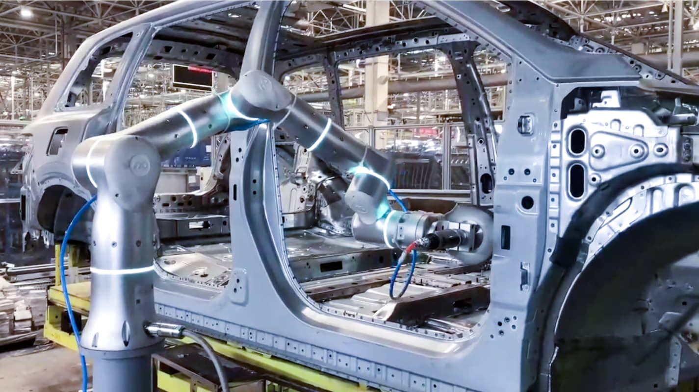A Flexiv robot developed with Isaac ROS and Isaac Sim deployed as a welding arm in a car factory.