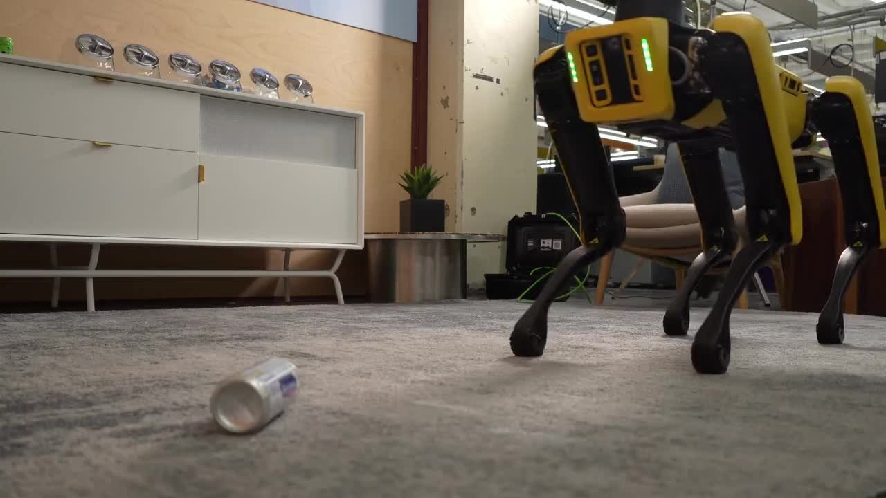 Gemini 4 Argon controls Spot to pick up cans and toss them into a trash bin using the pedal, after practicing the sequence in a MuJoCo simulation. | Image: Google